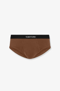 Tom Ford men’s stretch cotton briefs in beige with a black waistband featuring the brand logo in white