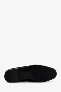Black leather oxford shoe with sleek polished finish and subtle heel shown from the back side in tom ford men’s suede loafers brown product image