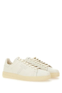 Cream-colored leather Tom Ford men’s Warwick sneaker with minimalist design and side perforated detailing in white