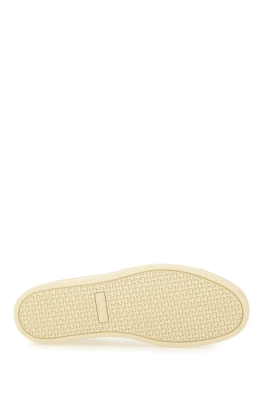 Cream-colored rubber sole with woven texture and rectangular indentation on the back of tom ford men’s warwick sneaker white