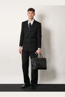 Black leather briefcase with structured design and top handles featured with Tom Ford men’s wool trousers black product