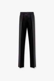 Tom Ford men’s black wool tailored trousers with sleek straight-leg cut and subtle pleats at the waistband