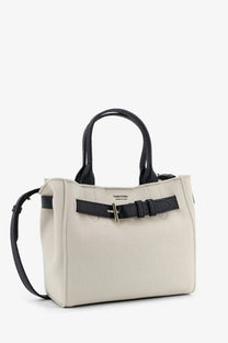Cream-colored Tom Ford women’s Audrey canvas handbag with black leather handles and belt-style front strap