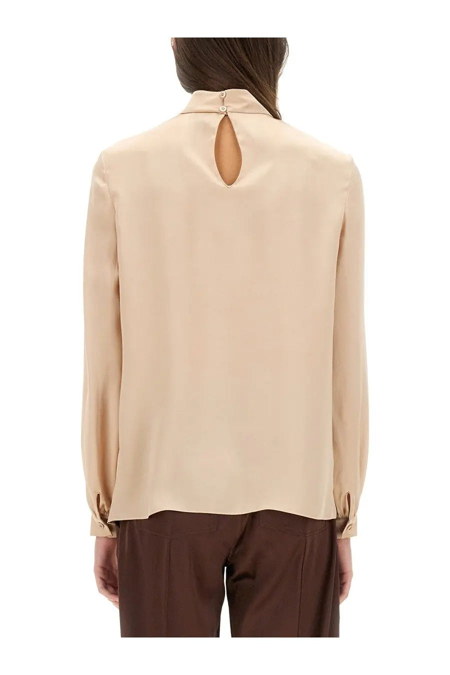 Beige satin blouse with keyhole back detail and buttoned cuffs shown from the back in tom ford women’s silk pink collection