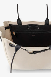 Beige canvas tote bag with black leather handles and trim featuring gold-tone zipper pull tom ford womens shoulder bag black