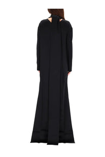 Back view of tom ford women’s black long sleeved maxi cocktail dress with tie detail and subtle vertical seam