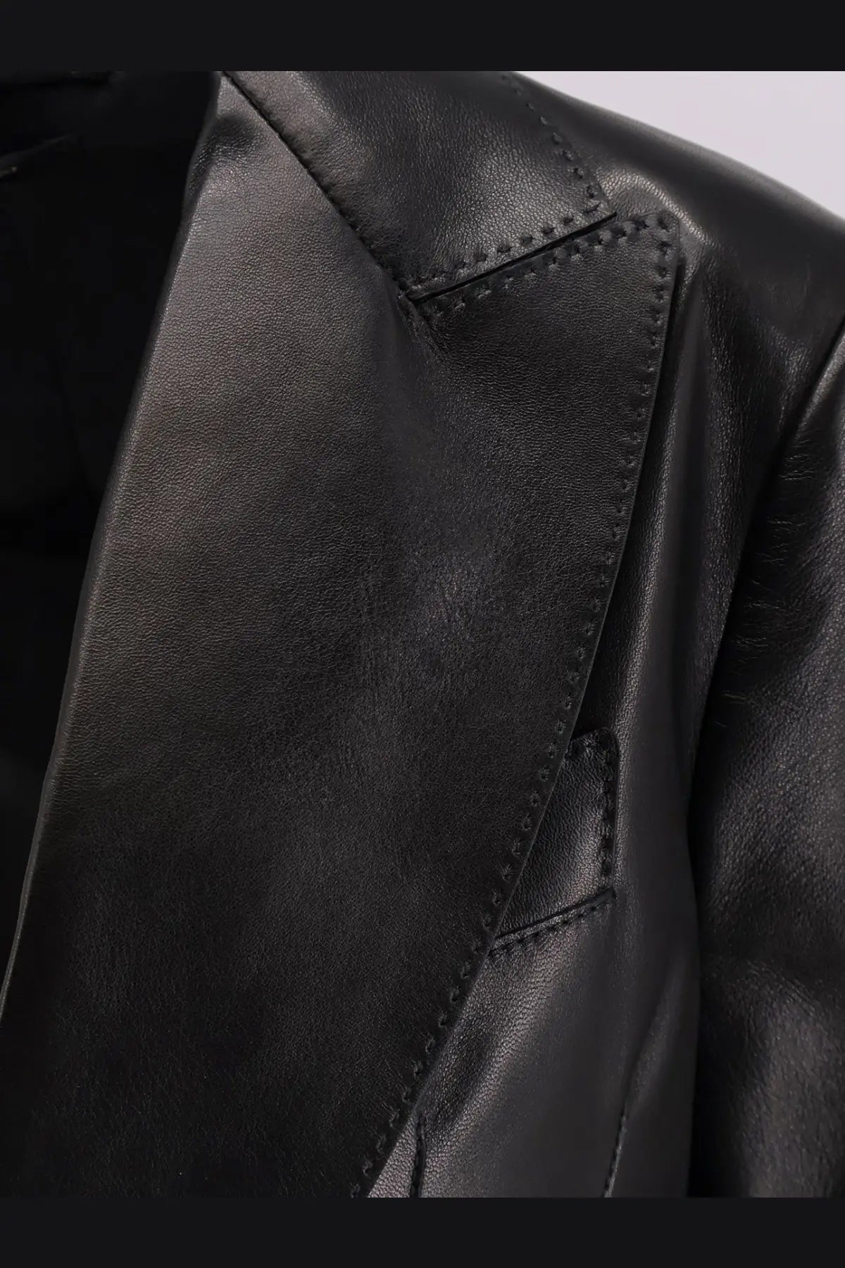 Tom Ford women’s black leather blazer with precise stitching and a sleek tailored design