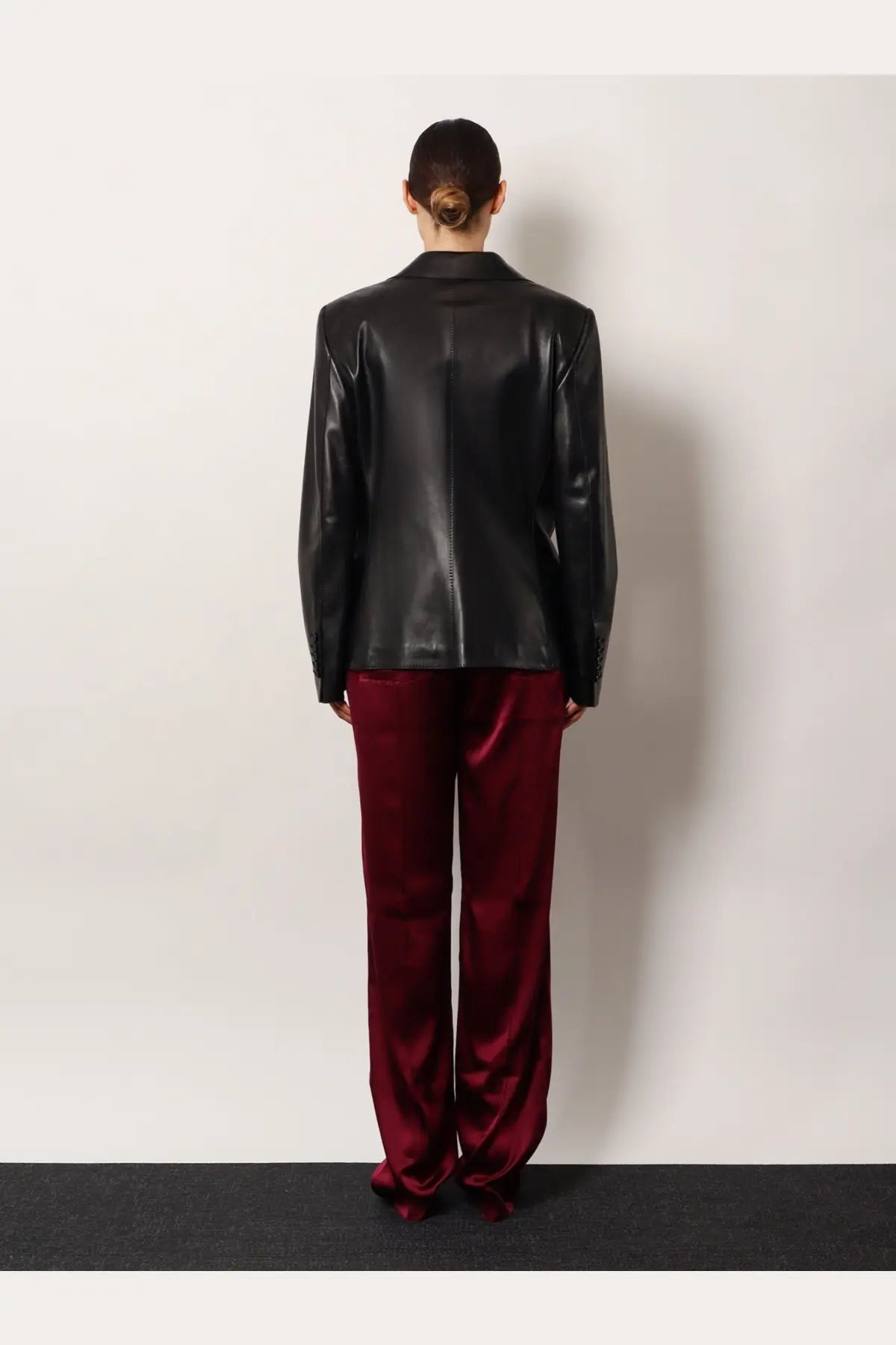 Tom Ford women’s black leather blazer with sleek structured design and subtle stitching details