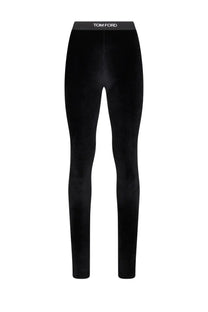 Black velvet tom ford women’s leggings with sleek form fitting design and white logo embroidered at waistband