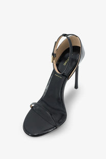 Tom Ford women’s black patent leather high-heeled sandal with slender ankle strap and gold-tone buckle