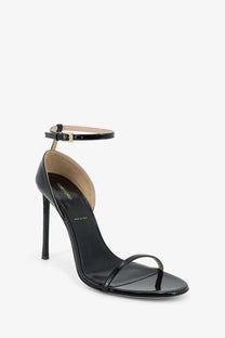 Tom ford women’s patent leather black high-heeled sandal with slender stiletto heel and ankle strap