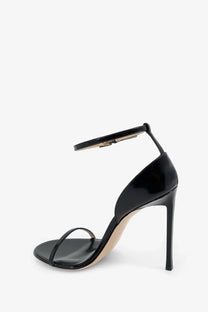 Tom Ford women’s black patent leather strappy high heel sandal with slender stiletto heel and ankle strap