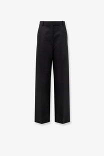 Tom Ford women’s pleated wool trousers in black featuring high-waisted wide-leg tailored fit