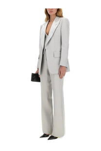 A sleek light gray tom ford women’s single breasted tuxedo jacket with tailored blazer and wide leg trousers