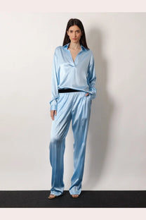 Light blue stretch satin pajama set with button-up shirt and wide-leg pants by Tom Ford women’s grey collection