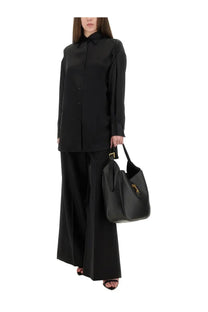 Black leather tote bag with gold-tone hardware ideal for stylish everyday use by tom ford women’s collection