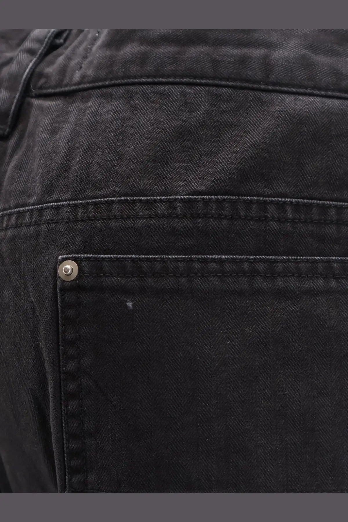 Back side of tonywack men’s black cotton cargo bermuda shorts with subtle herringbone weave and silver rivet
