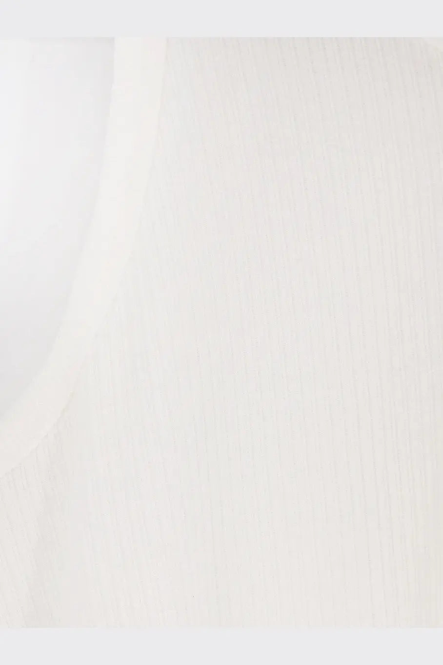 A smooth off-white ceramic tile with subtle vertical texture shown with tonywack men’s lyocell blend tank top white