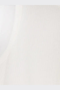 A smooth off-white ceramic tile with subtle vertical texture shown with tonywack men’s lyocell blend tank top white