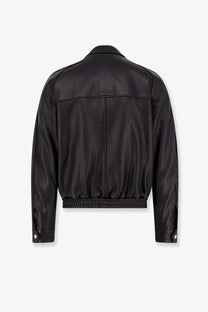 Tonywack men’s vintage black leather jacket with relaxed fit and elastic waistband visible from the back side
