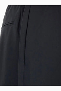 Tonywack men’s black wool blend tailored trousers with sleek minimalist design and subtle side seam pleating