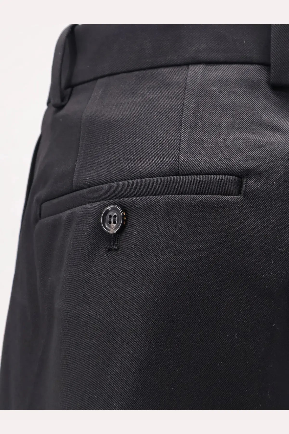 Tonywack men’s black wool blend trousers with textured fabric tailored fit and subtle button detail on front pocket