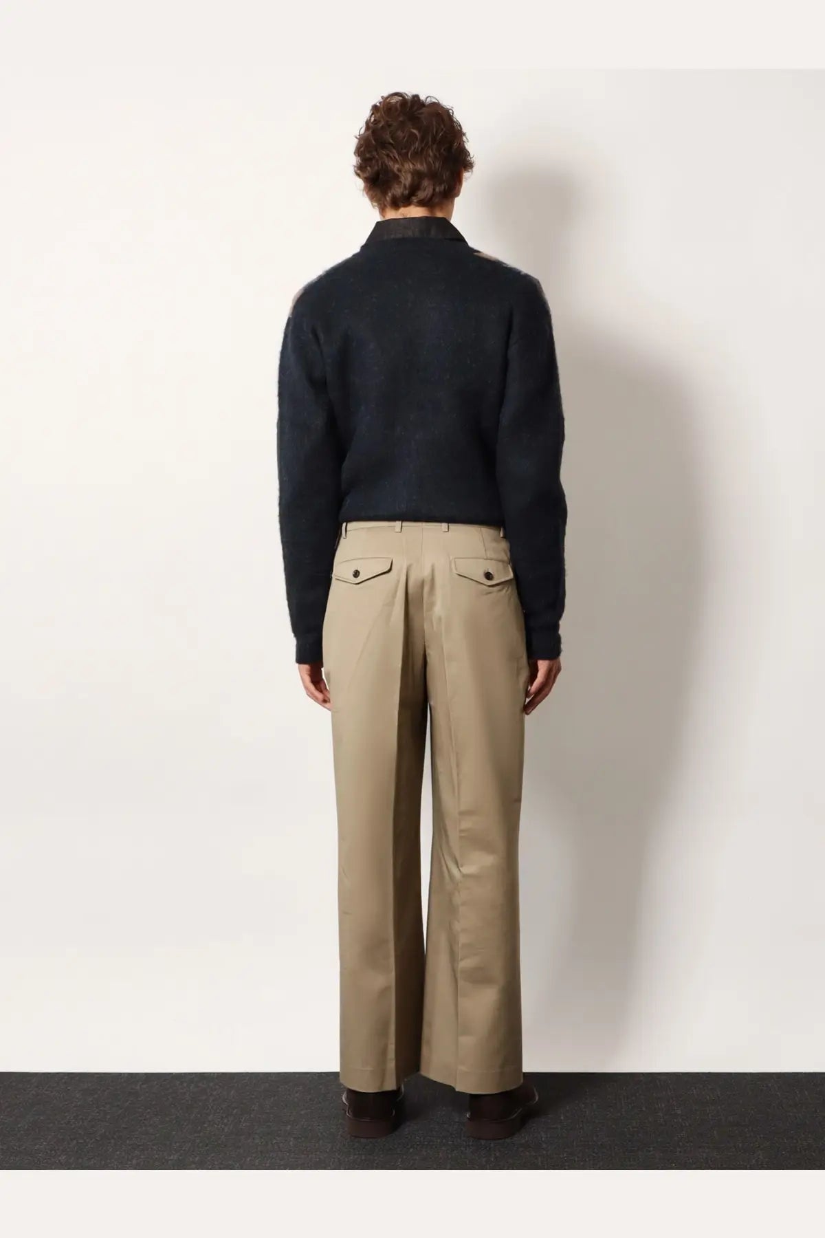 Beige cotton wide-leg trousers by tonywack with two front pockets and a tailored fit for unisex wear