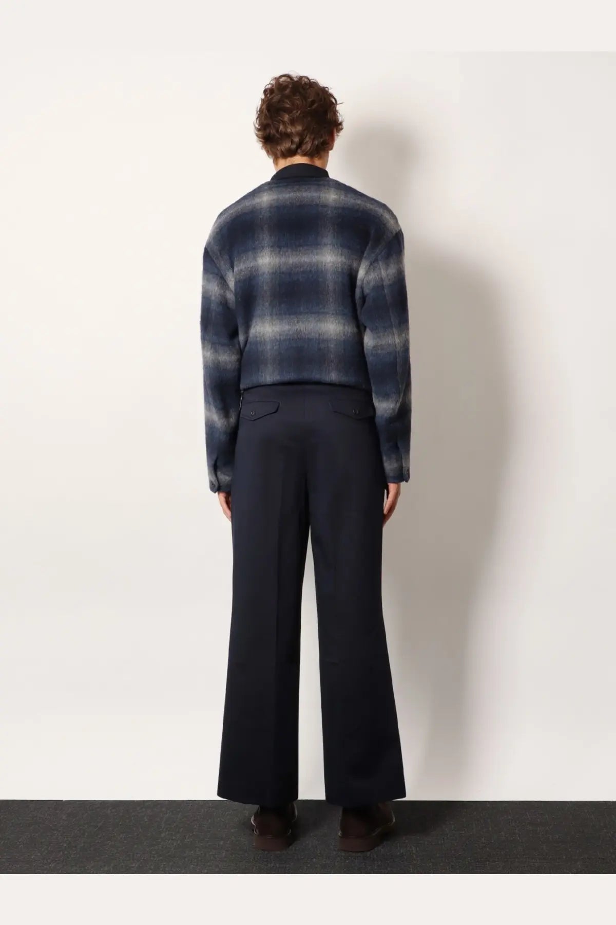 Navy blue and gray plaid woolen sweater with relaxed fit paired with tonywack unisex cotton blue trousers