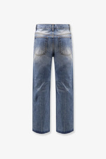 Tonywack unisex blue denim jeans with a faded distressed wash and a wide-leg flared cut
