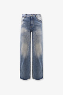 Tonywack unisex blue denim jeans with a faded gradient wash and flared leg design