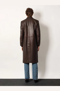 A sleek dark brown leather trench coat by Tonywack featuring a classic double breasted design and subtle stitching details