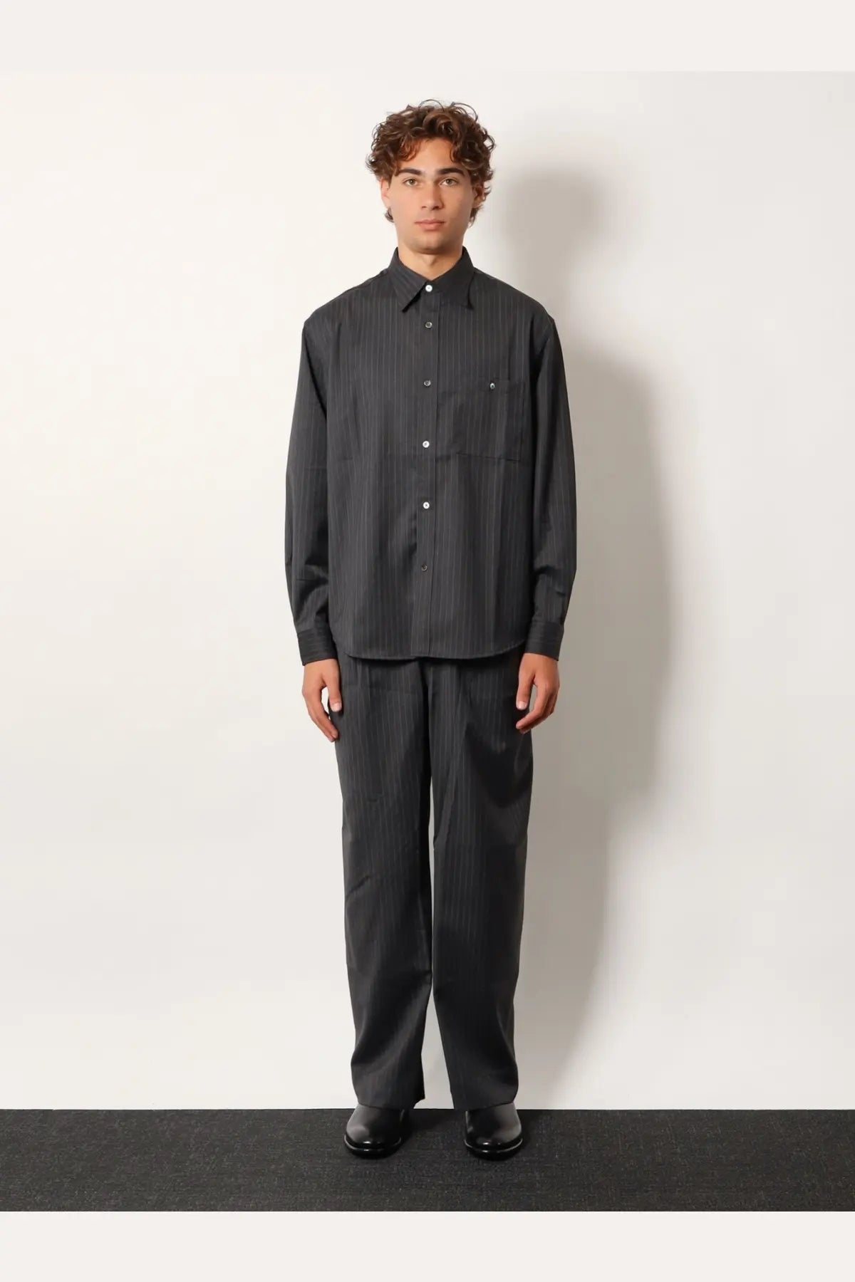 Dark gray pinstripe button-down wool blend shirt with subtle vertical stripes and classic collar by tonywack