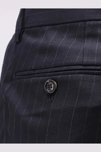 Dark navy pinstripe wool blend trousers by tonywack with subtle sheen and black button at the waistband