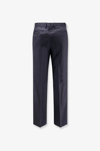 Dark navy tonywack unisex wool blend tailored trousers with straight-leg cut and back pleats shown from the back