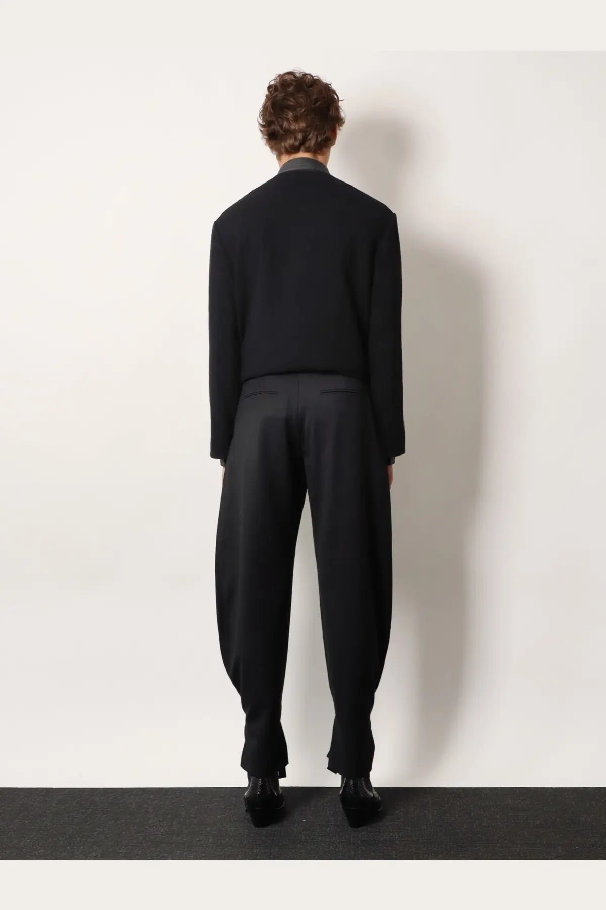 Black tailored wool blend suit featuring a structured blazer and wide-leg trousers for unisex wear by Tonywack