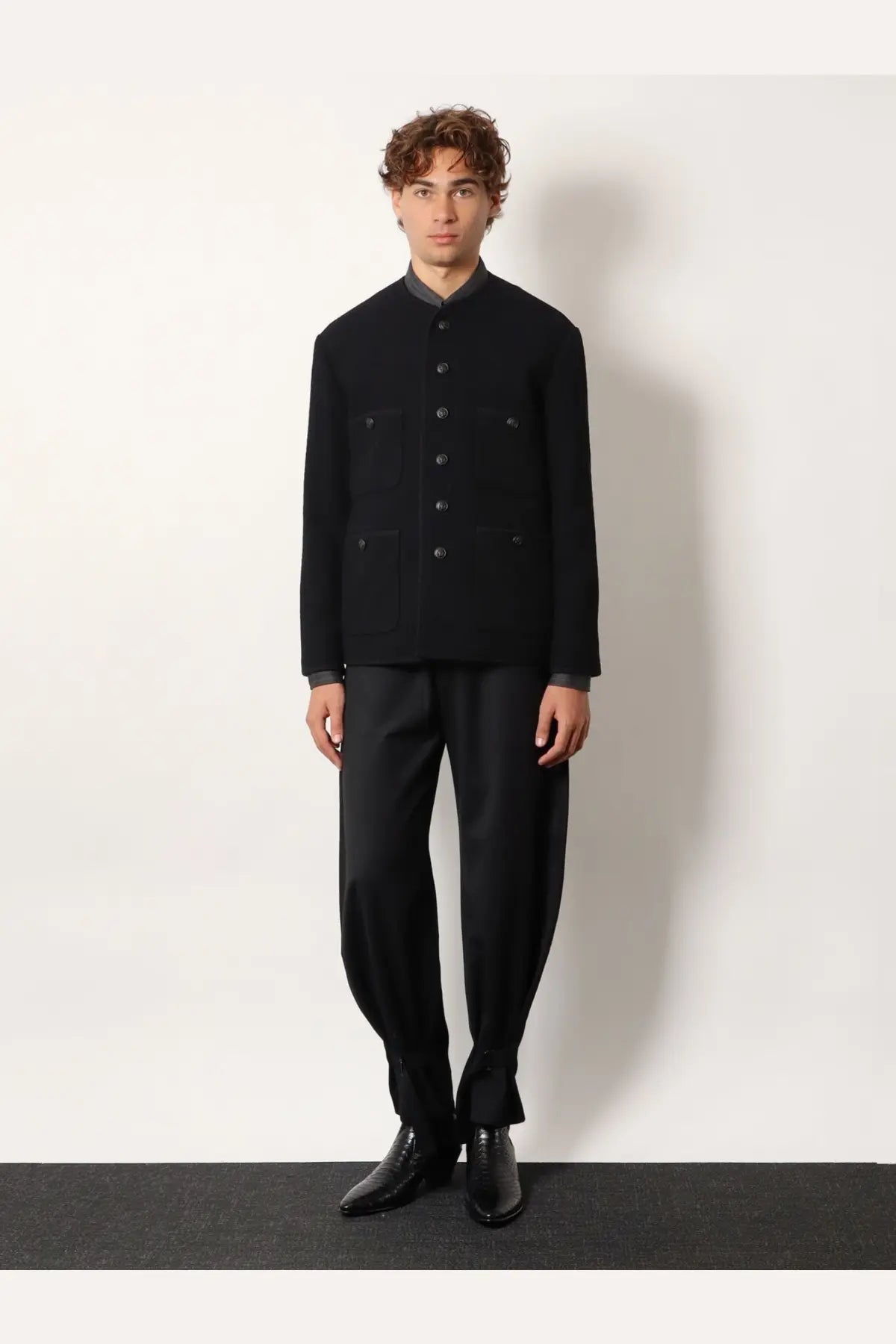 Black woolen jacket with stand-up collar dark gray lining front button closure and two flap pockets by tonywack