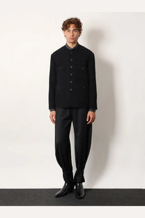 Black woolen jacket with stand-up collar dark gray lining front button closure and two flap pockets by tonywack
