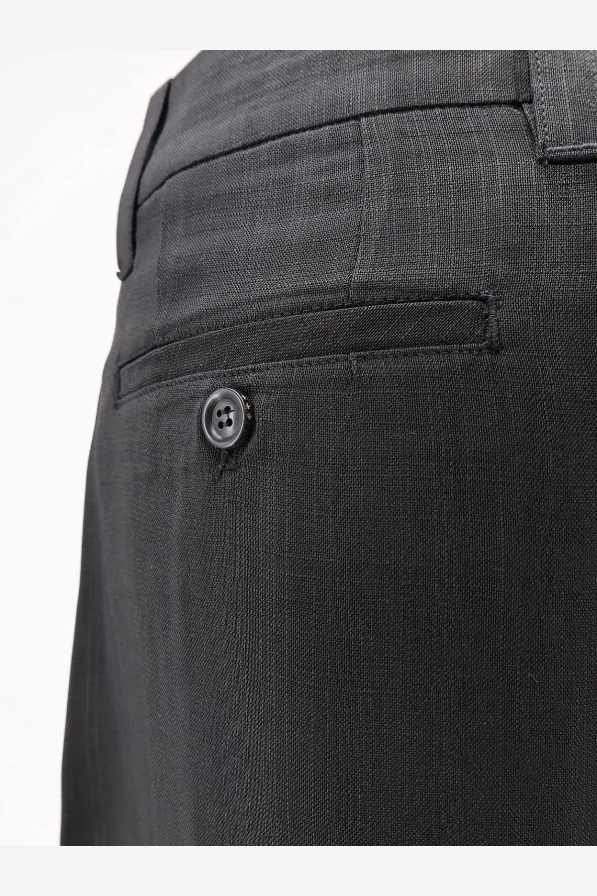 Tonywack women’s airy rayon trousers in black featuring dark gray textured fabric with a subtle woven pattern and matching button closure