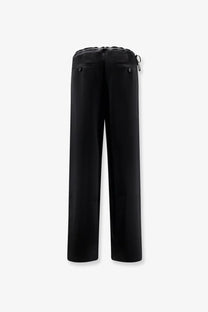 Tonywack women’s black satin wide-leg trousers with a drawstring waist and subtle button details