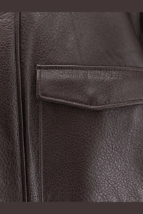 Tonywack women’s unisex dark brown leather jacket with textured surface and stitched pocket detail