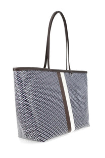 Tory Burch women’s tote bag in racer blue with gray and white geometric pattern and brown leather trim and handles