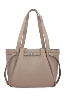 Beige leather tote bag with silver-toned clasp and adjustable shoulder strap from tory burch women romy collection