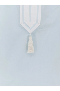 White geometric curtain tie-back with matching tassel complements the blue cotton tory burch women’s tunic shirt