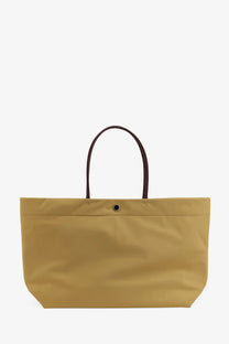 Tory burch women’s ella twist nylon shoulder bag in mustard yellow with dark brown leather handles and black snap closure