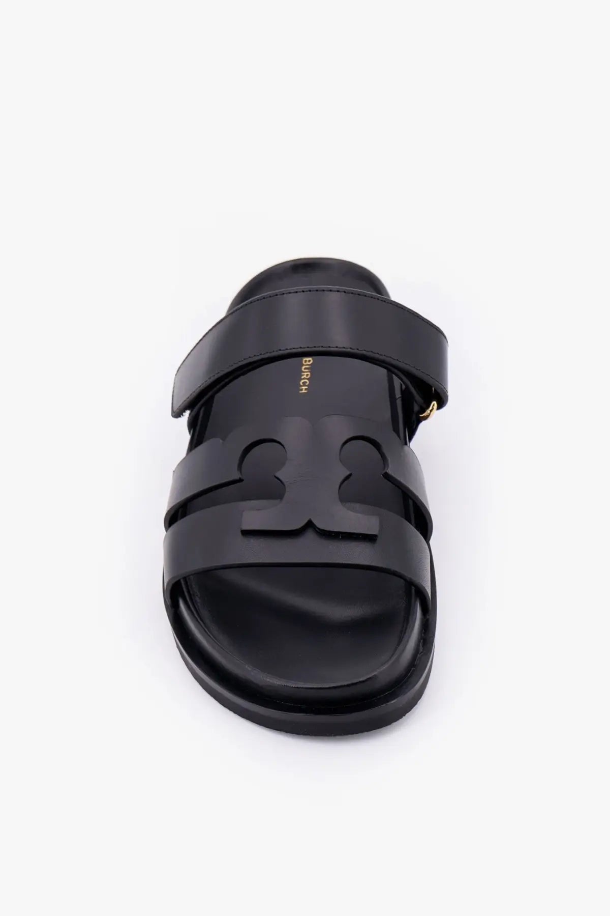 Black leather slide sandal with bold embossed logo across footbed tory burch womens ines leather sandals grey