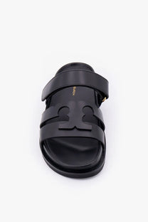 Black leather slide sandal with bold embossed logo across footbed tory burch womens ines leather sandals grey