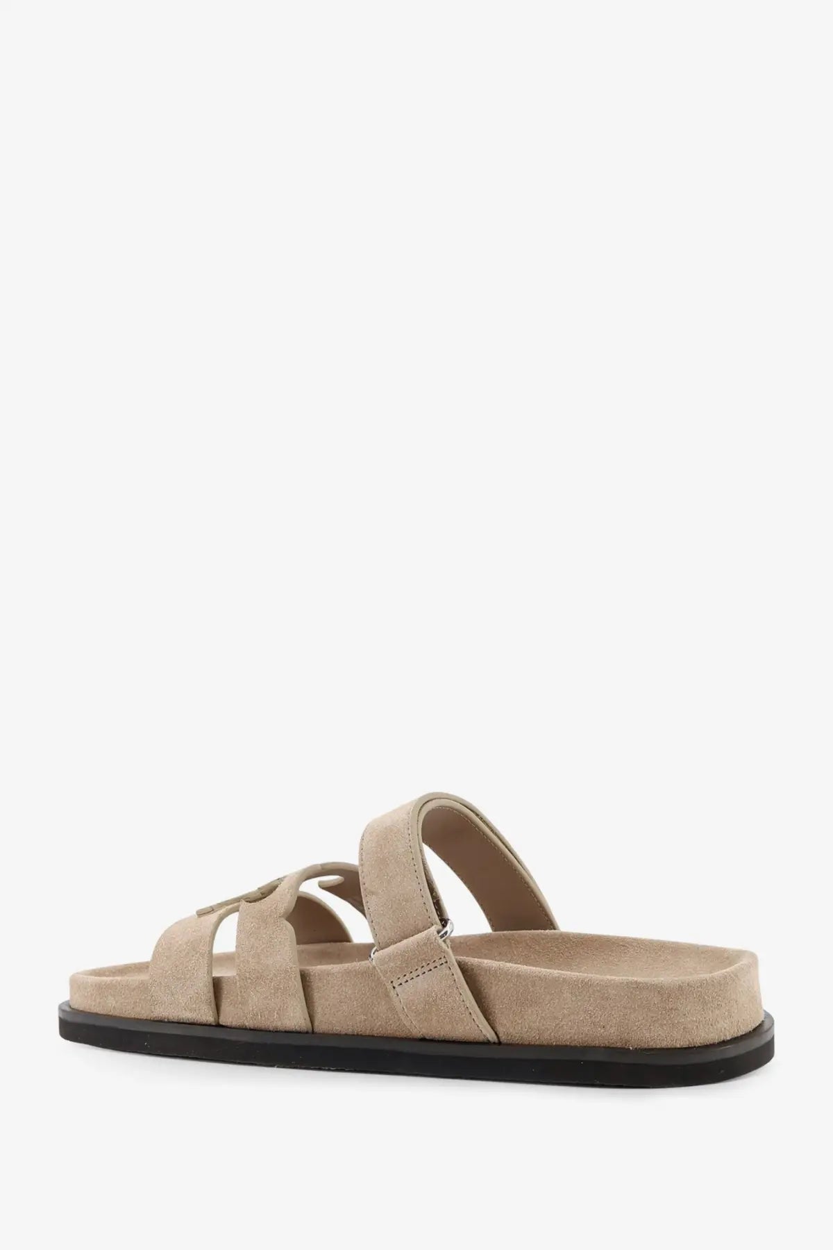Beige suede Tory Burch women’s Ines low slide sandal with black rubber sole and adjustable strap design