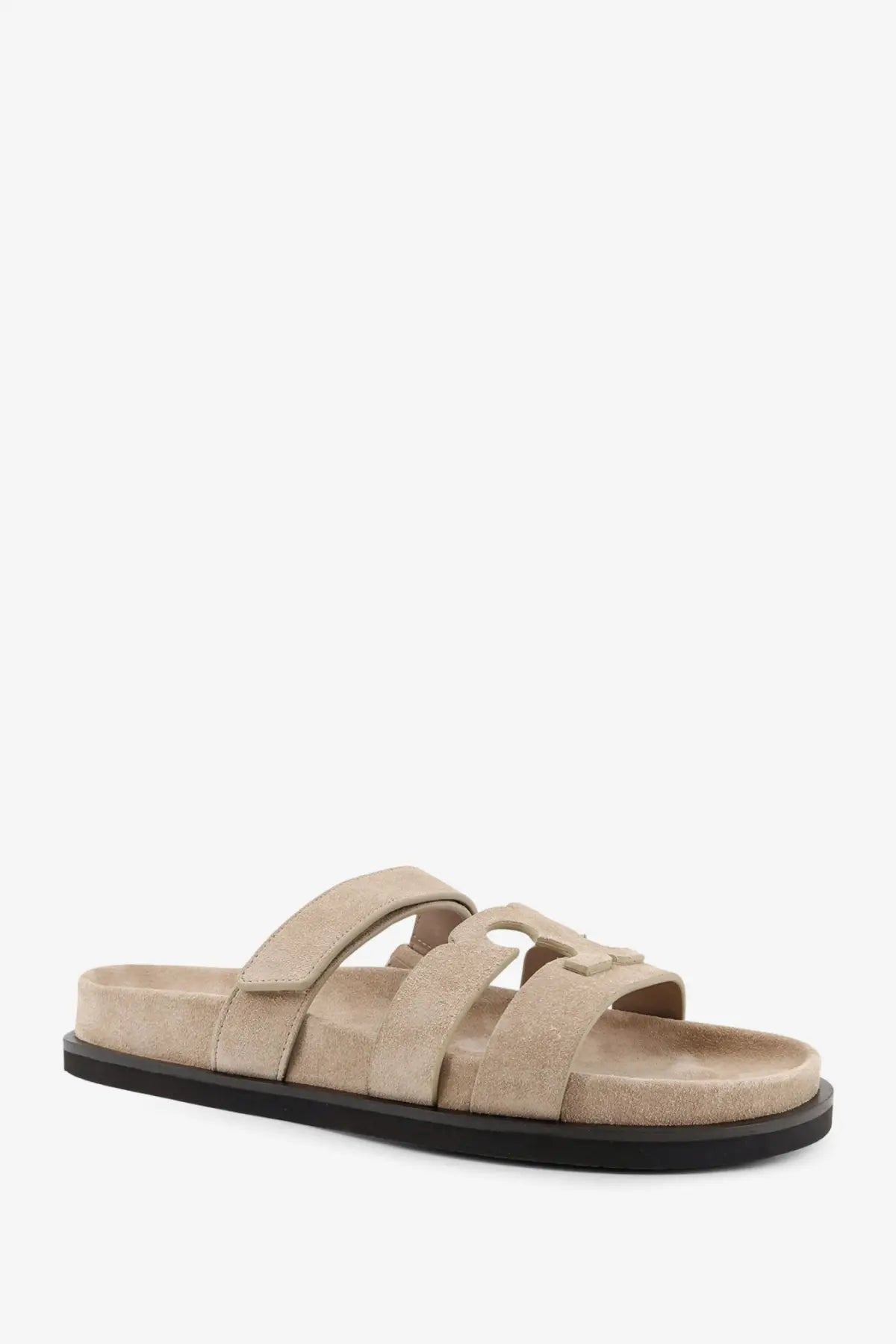 Tory Burch women’s Ines low suede slide sandal in beige with black rubber sole and three overlapping straps
