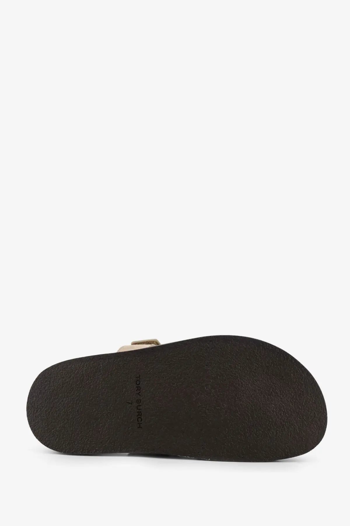 Dark brown rubber sole with subtle texture and toms branding on tory burch womens ines low suede sandals avola