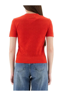 Tory Burch women’s red jacquard monogram short-sleeved knit top with subtle textured pattern and neckline tag